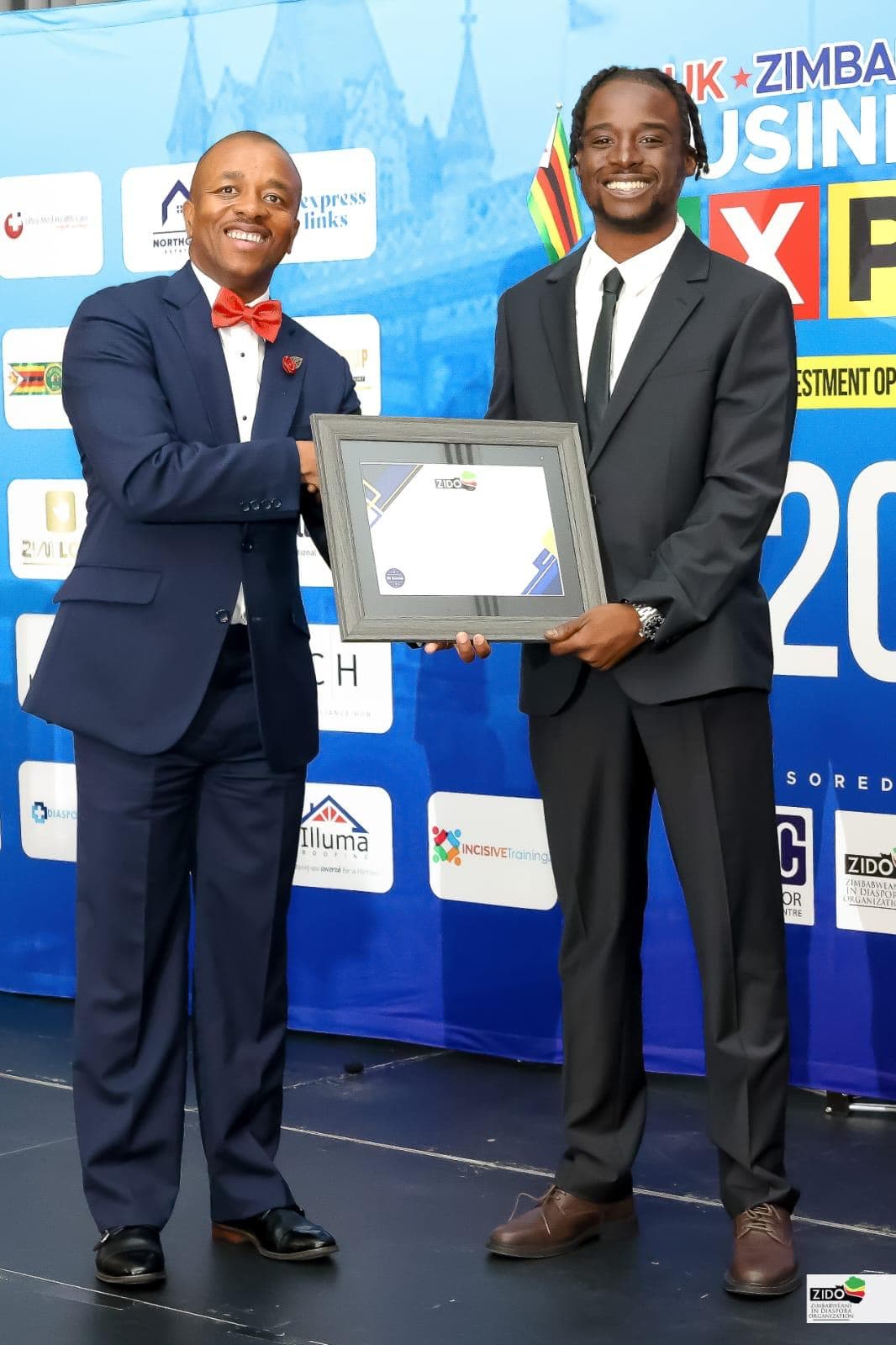 Emperor Roy receiving award at the UK-Zimbabwe Business Expo